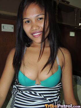 Filipina cutie shows off her boobs in a motel room for a sex tourist