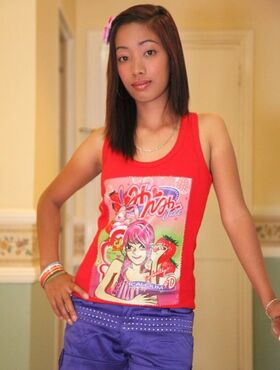 Young looking Asian girl Lalaine puts her trimmed muff on display