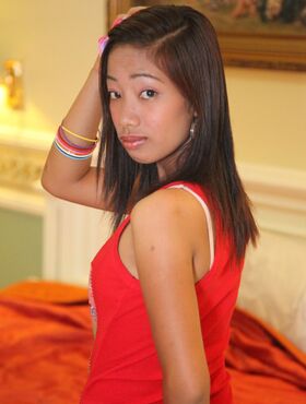 Young looking Asian girl Lalaine puts her trimmed muff on display