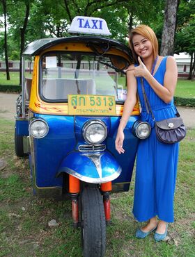 Beautiful Thai girl Mon flirting with a cute male tourist in public