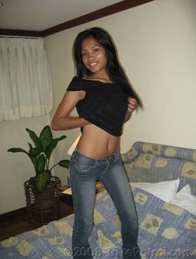 Petite Filipino girl Lyza teasing nude on her bed before having sex