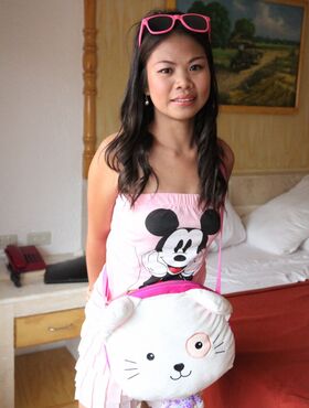 Petite Asian first timer removes Mickey Mouse top on way to getting naked