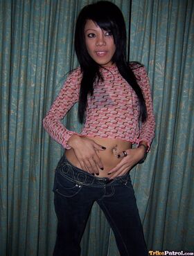 Cute girl from Manila sets her little titties free of a bikini top in jeans