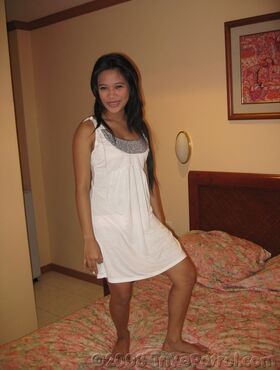 Cute Filipina first timer blows a Farang on a motel room bed in her porn debut