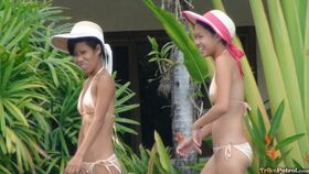 Petite Filipino spinners Jeremay & Mayka flash shaved pussy in the pool