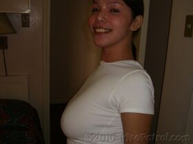 Filipina first timer cups her big naturals after undressing on a bed