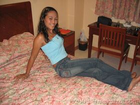 Amateur Asian teen poses in tight jeans and disrobes to give a naked blowjob