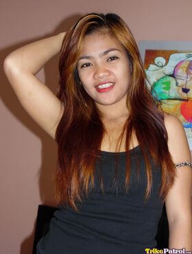 Redheaded Filipina cutie pleasures a white sex tourist's dick on a bed