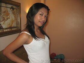 Pinay amateur Bianca gets undressed for a nude solo shoot on a bed