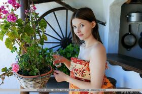 Nice teen Stasey waters her plants prior to modelling totally naked