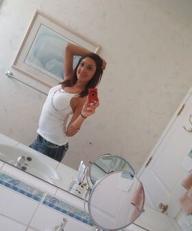 Nasty brunette slut Nikka taking couple of selfies in the bathroom