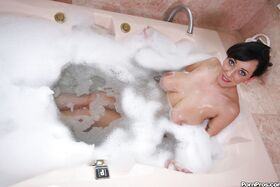 MILF babe with huge boobs Alia Janine takes a bath naked