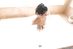 MILF with big boobs Jaylene Rio soaking her body in the bath