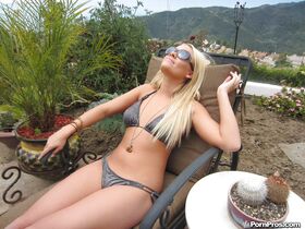 Teen babe Alexis Monroe is demonstrating her body outdoor in a bikini
