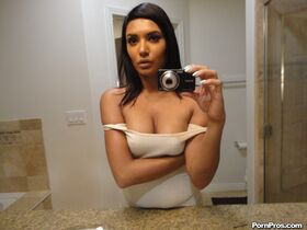 Brunette Arab babe Shazia Sahari takes sexy selfies in front of the mirror