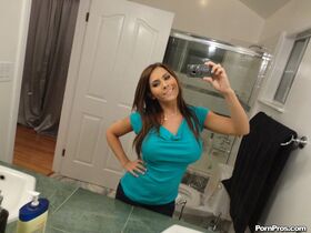 Brunette Madison Ivy takes sexy selfies and shows her big tits in the bathroom