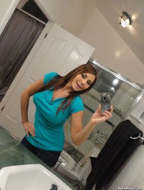 Brunette Madison Ivy takes sexy selfies and shows her big tits in the bathroom
