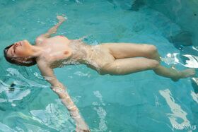 Sweet teen Nikia goes for a skinny dip during solo action