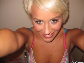 Short haired blonde Tristan Taylor undresses on bed to appease her boyfriend