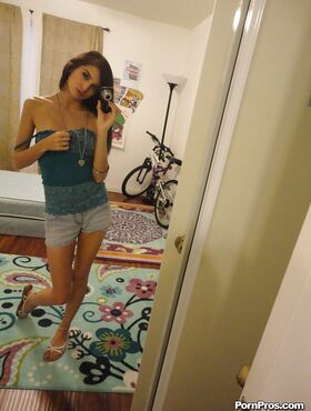 Slender female Zoey Kush ditching her shorts and top while taking selfies