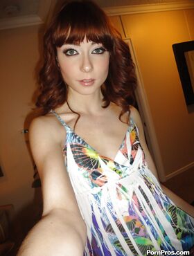 Slender redhead ex-gf Zoe Voss snaps self shots of herself getting undressed