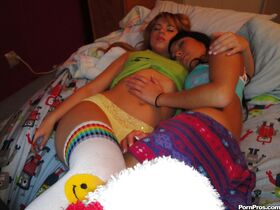Teen lesbo babes Jesse and Lexi sleeping together and licking pussy