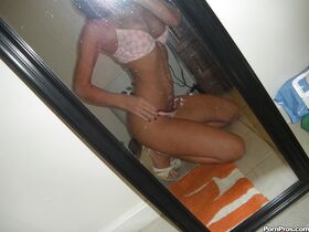 Hot brunette chick Micah Moore taking nude selfies in bathroom mirror