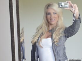 Platinum blonde beauty Tasha Reign taking selfies while getting naked