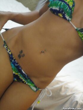 Hot babe Capri Cavanni takes self shots exposing big tits and body in bikini