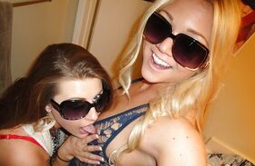 Teen lesbians in glasses Brooke and Jessie strip to finger pussy