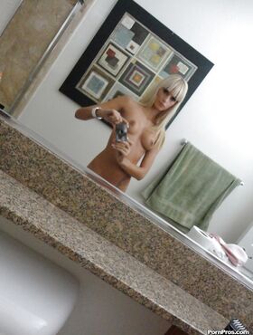 Blonde ex-girlfriend Erica Fontes taking mirror self shots while undressing