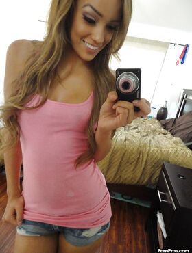 Pretty Latina ex-gf Melanie Rios taking topless self shots in the mirror