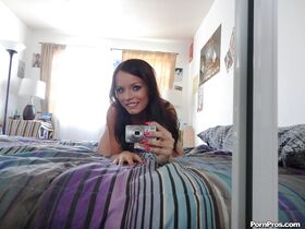 Glamorous brunette with natural breasts Kari Sweet takes naked selfies