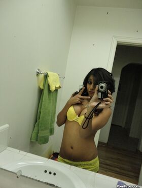 Brunette girlfriend type Ruby Reyes takes self shots on exposed boob in mirror