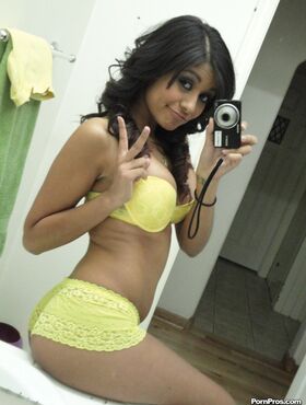 Brunette girlfriend type Ruby Reyes takes self shots on exposed boob in mirror