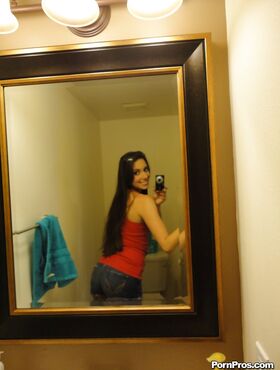 Teen babe Bailey Bam strips by the mirror and makes amateur shots