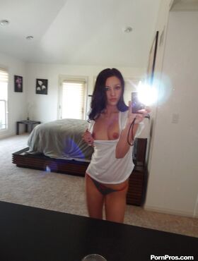 Gorgeous brunette teen Morgan Brooke shows her ass while she does self shots