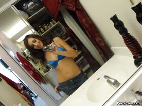 Girlfriend posing naked while taking photos of her pussy and tits