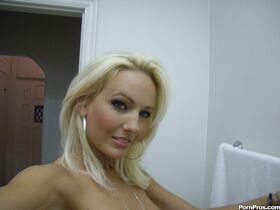 Hot blond gf Cody Love snapping selfies of her perfect tits in bathroom mirror