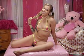 Delicious teen Rory Knox shows her curvy tattooed body in a tiny bikini