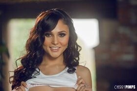 Gorgeous pornstar Ariana Marie reveals her tiny nipples and poses topless