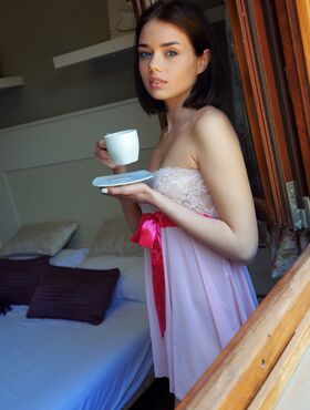 Sweet teen Keira Blue gets completely naked while taking a cup of tea