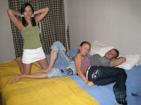 Young looking girls surprise man friend with an impromptu threesome