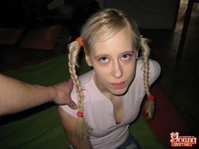 Young blonde sports braided pigtails while having sex with her bolyfriend