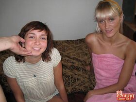 Young girls share a kiss before commencing on a POV threesome