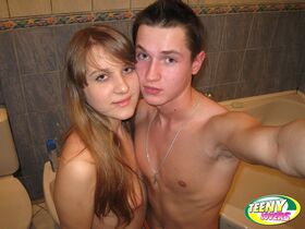 Teen couple take self shots while having sex in a bathtub