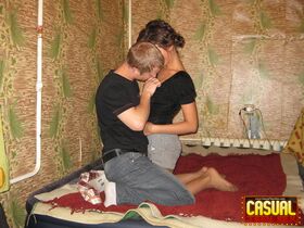College girl and her boyfriend undress before intercourse on a bed