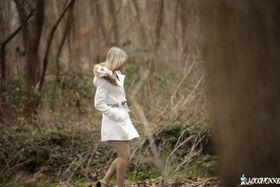 French blonde Alix Feeling poses and gives a double blowjob in the woods