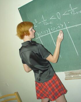 Redheaded student Strelka strips in the classroom and touches her hot body