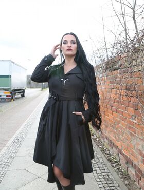 Gorgeous black haired German MILF reveals bulbous & massive big tits outdoors
